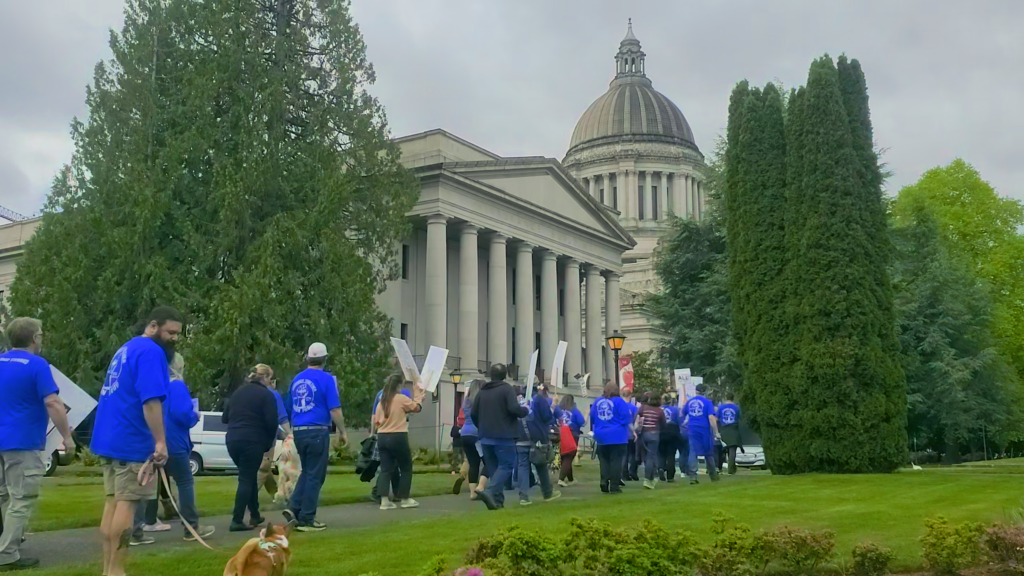 WPEA Members marching towards the Washington state capitol building in Olympia.